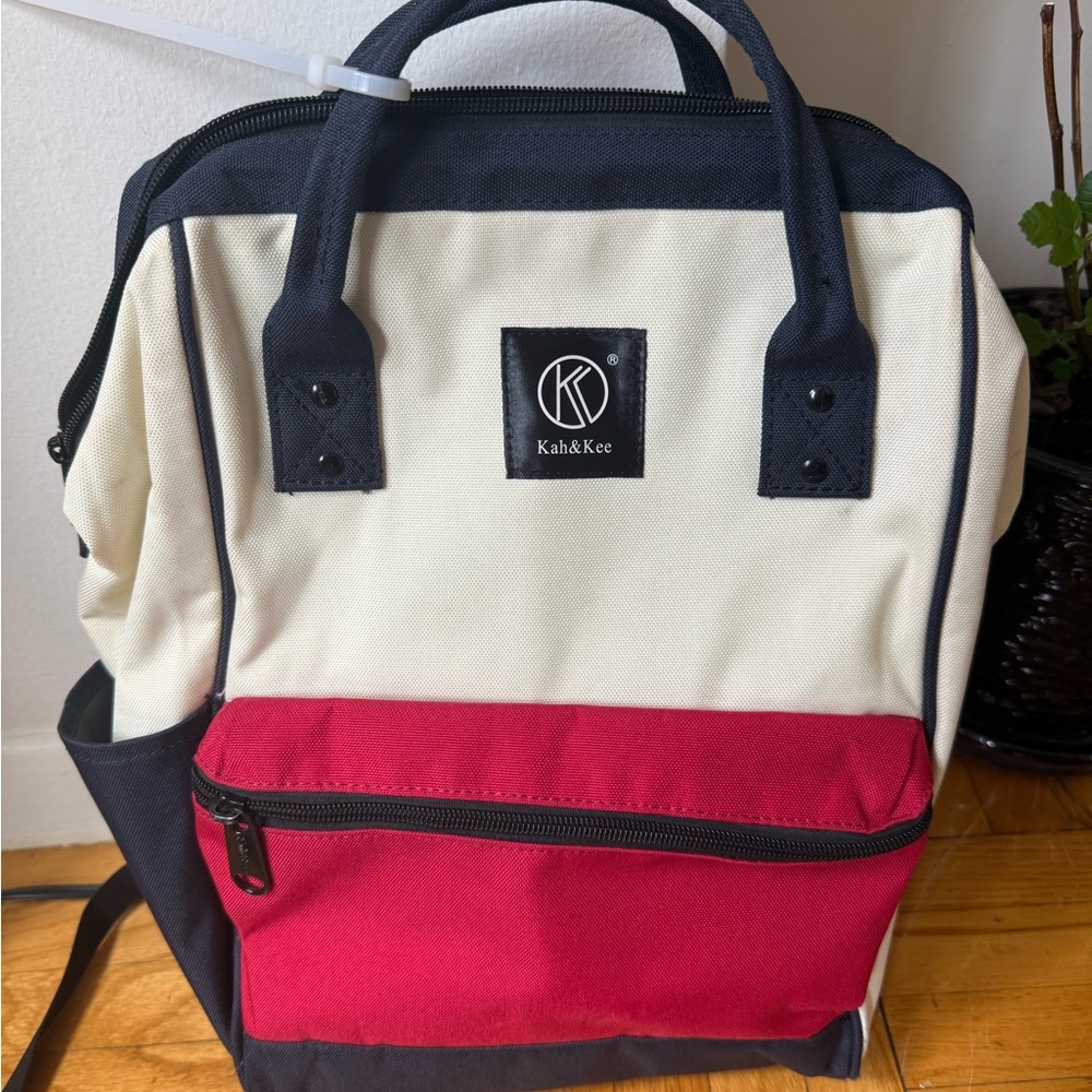 Kah&Kee Red and Navy Travel Bag with Structured Design